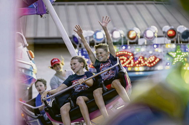 Families from the Kaiserslautern Military Community ride a carnival attraction during Freedom Fest at Ramstein Air Base, Germany, July 4, 2026. The two-day fest brought together service members and families from the KMC in a shared celebration of partnership and 250 years of American independence. (U.S. Air Force photo by Airman 1st Class Joseph Curzi)