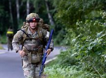 U.S. Air Force Senior Airman Logan Mew, 435th Security Forces Squadron contingency response team member, performs a 12-mile ruck march during the 435th Security Forces Squadron Air Assault assessment at U.S. Army Garrison Baumholder, Germany, July 9, 2026. The ruck march tested the Air Assault School candidate’s physical endurance and mental resilience to prepare them for the demands of the course. (U.S. Air Force photo by Senior Airman Jason Jones Jr.)