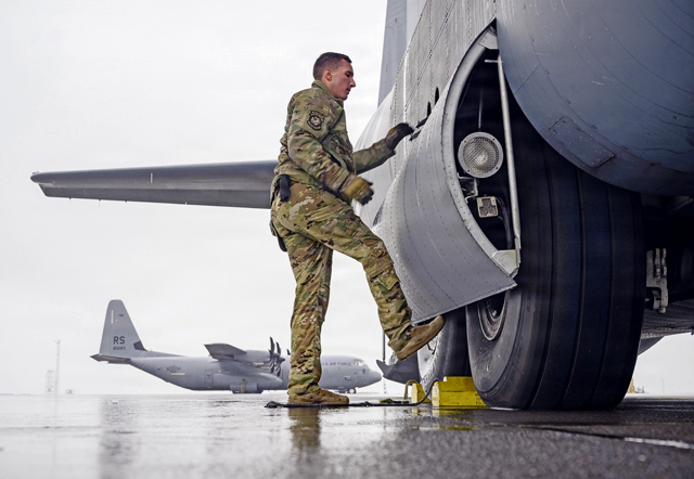 U.S. Air Force Master Sgt. Alexander Lauher, 86th Operations Support Squadron wing tactics flight chief, performs pre-flight checks and secures the wheel well doors on a C-130J Super Hercules aircraft for a flight supporting exercise Northern Viking 26 at Keflavík Air Base, Iceland, Aug. 22, 2026. NV26 strengthens interoperability and force readiness among the U.S., Iceland and Allied nations, enabling multidomain command and control of joint and coalition forces defending Iceland and defending the increasingly contested Arctic and North Atlantic. (U.S. Air Force photo by Senior Airman Edgar Grimaldo)