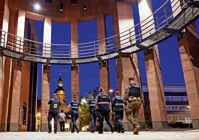 U.S. Air Force personnel assigned to the 569th U.S. Forces Police Squadron walk alongside German police officers during a joint patrol in Kaiserslautern, Germany, Aug. 8, 2026. The patrol maintained a visible law enforcement presence in the city’s old town to deter misconduct, reassure residents and strengthen trust between the two police organizations. (U.S. Air Force photo by Senior Airman Edgar Grimaldo)