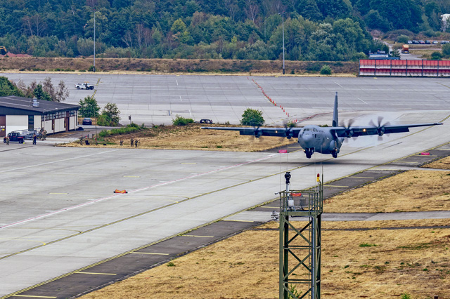 A C-130J Super Hercules aircraft lands on a taxiway at Ramstein Air Base, Aug. 18. The training ensured airfield personnel maintain the proficiency required to execute precision landings on short, narrow and unmarked strips of land. Photo by Airman 1st Class Joseph Curzi