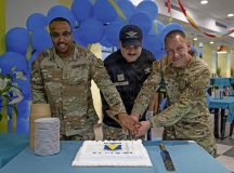 U.S. Air Force Chief Master Sgt. Ronald Weaver, left, 86th Security Forces Squadron senior enlisted leader, Airman 1st Class Cody Danz, 786th Force Support Squadron food service journeyman, and Col. Jason Schenck, 86th Mission Support Group commander, cut a cake during Ramstein Air Base's 74th anniversary celebration at the Rheinland Dining Facility on Ramstein Air Base, Germany, Aug. 5, 2026. The event commemorated the installation's history, beginning with the opening of Landstuhl Air Base in 1952 before the installation became officially known as Ramstein Air Base in 1958. (U.S. Air Force photo by Senior Airman Edgar Grimaldo)