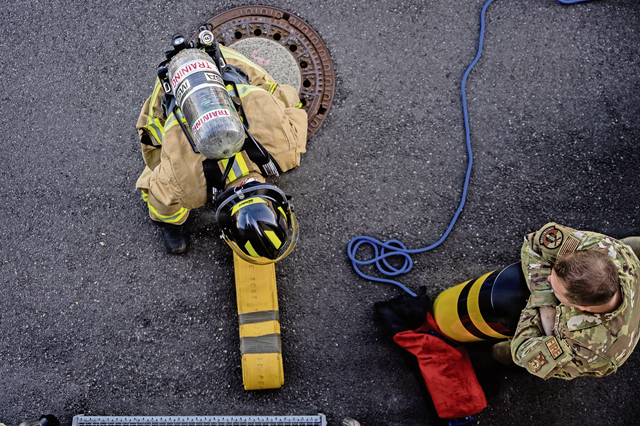 U.S. Air Force Staff Sgt. Brycen Hand, right, 86th Civil Engineer Squadron Fire and Emergency flight station chief, instructs Airman 1st Class William Schwartz, 86th CES firefighter, during strength and endurance training at Ramstein Air Base, Germany, Aug. 6, 2026. Firefighters tested their physical capabilities through a series of firefighter-specific challenges designed to mirror the demands of real-world emergencies. (U.S. Air Force photo by Airman 1st Class Joseph Curzi)