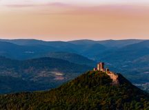 Burg Trifels Illuminated by the Setting Sun in Palatinate Forest. Photo by Maximiliane Wagner/Shutterstock.com