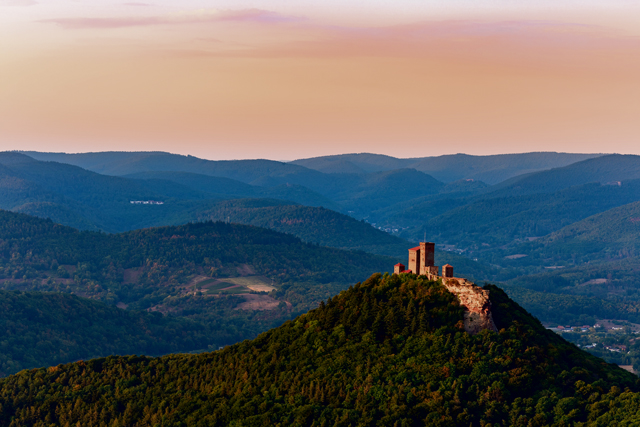 Burg Trifels Illuminated by the Setting Sun in Palatinate Forest. Photo by Maximiliane Wagner/Shutterstock.com