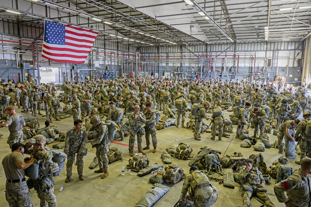 U.S. Army paratroopers prepare for a joint forcible entry operation during exercise Saber Junction 26 at Ramstein Air Base, Germany, Aug. 26, 2026. The exercise event integrated U.S. Army airborne forces with U.S. Air Force and Marine Corps aircrews to rehearse the coordination required to rapidly project combat power by air. (U.S. Air Force photo by Senior Airman Brenden Beezley)