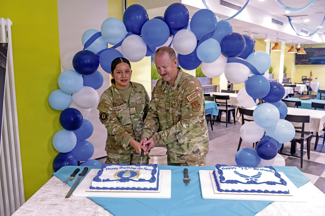 U.S. Air Force Airman Hillary Cevallos Castillo, 86th Comptroller Squadron financial operations technician, and Chief Master Sgt. Joseph Wooldridge, 86th Munitions Squadron senior enlisted leader, cut a cake during the 79th Air Force birthday celebration at Ramstein Air Base, Germany, Sept. 18, 2026. The ceremony was held to celebrate the Air Force’s 79th birthday and honor the heritage that continues to inspire generations of Airmen. (U.S. Air Force photo by Senior Airman Jason Jones Jr.)