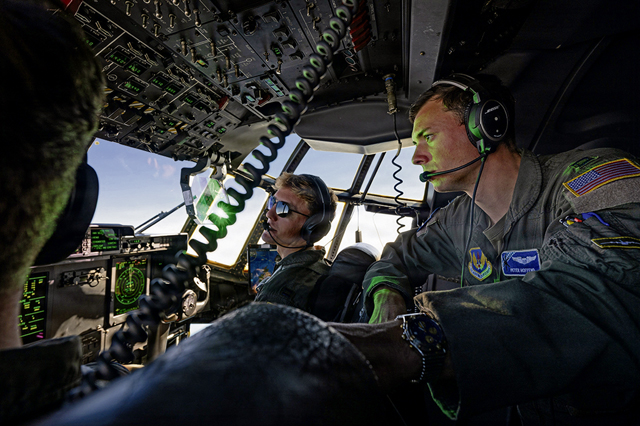 U.S. Air Force Capt. Eli Deroon, left, 86th Operations Support Squadron wing tactician, and Capt. Peter Hoffend, 37th Airlift Squadron pilot, fly a C-130J Super Hercules aircraft to a sand landing zone in Rømø, Denmark, during exercise Northern Viking 26, Aug. 25, 2026. U.S. aircrews worked alongside Danish Armed Forces personnel to coordinate training to land on unimproved surfaces makes aircrew more agile and capable of delivering personnel and equipment when established runways are unavailable or constrained. NV26 strengthens the agile and interoperable airlift capabilities needed to surge forces across the High North and defend the strategic approaches linking North America and Europe. (U.S. Air Force photo by Senior Airman Edgar Grimaldo)
