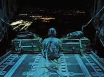 U.S. Air Force Senior Airman Bailey Vice, 37th Airlift Squadron Loadmaster, prepares to unload cargo to a nighttime drop zone during exercise Hussar Saber 26-4 on 33rd Air Base, Poland, Sept. 15th, 2026. Loadmasters account for everything involved in a tactical drop, from total weight and size of cargo, to travel speed and distance from the aircraft to the ground. (U.S. Air Force photo by Staff Sgt. Jon Anderson)